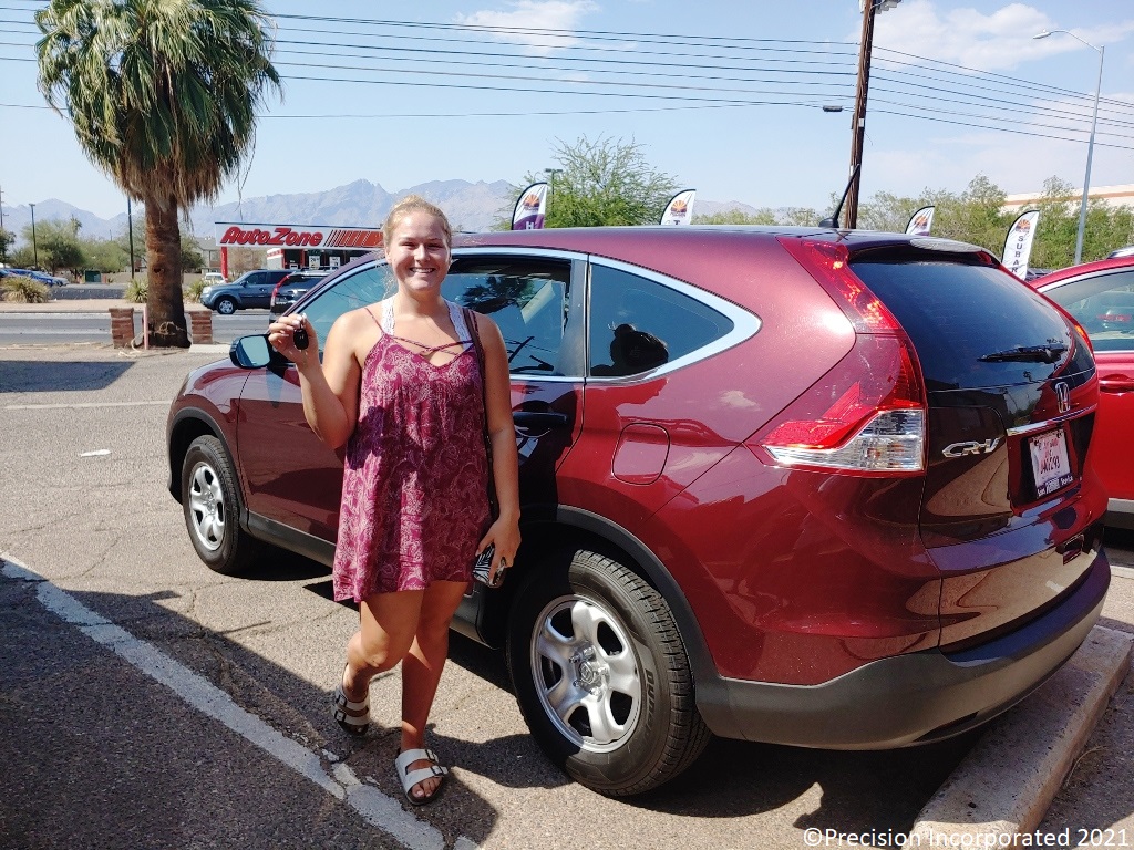 Young woman with her first Honda CR-V