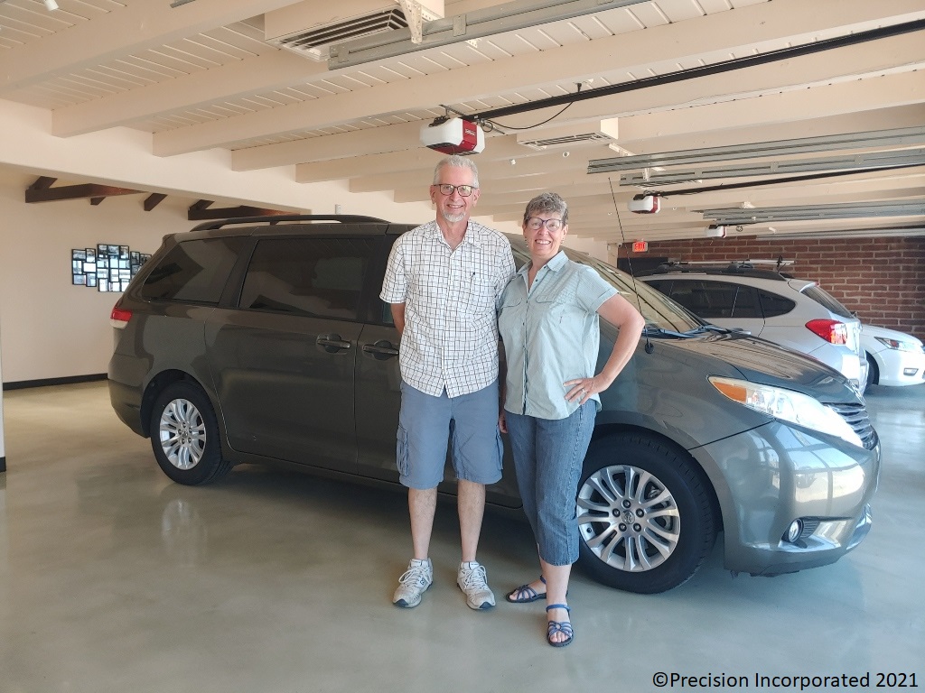 Happy couple with their new Toyota Sienna van.